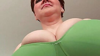Aged BBW with massive boobs fucks a long dildo