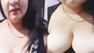 Mature Bhabhi teases Desi stud helps with breasts during live show