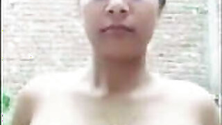 Indian girl inserts a brindjal in her pussy