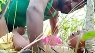 Young amateur couple lovers enjoy outdoor sexual activities in a rice paddy