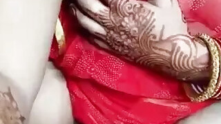 Shows off her big boobs through a red mesh sari while masturbating on StripChat
